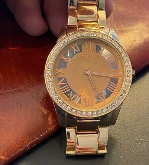 Women's Gold Tone Folio Watch, Crystal Accented Bezel, Roman Numeral Dial